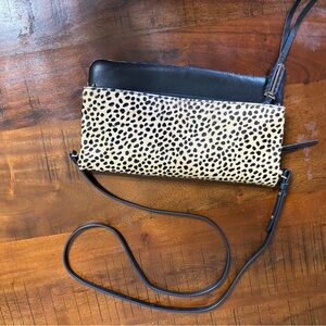 Cheetah and black leather Crossbody Bag in Black and Tan. (Covet)